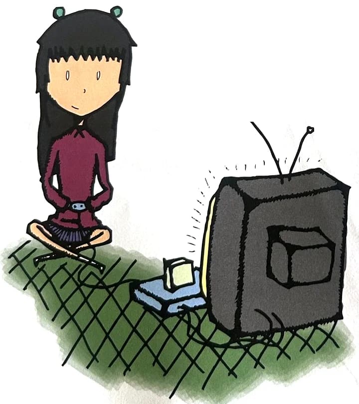 A girl sits cross-legged playing a video game on an old TV.