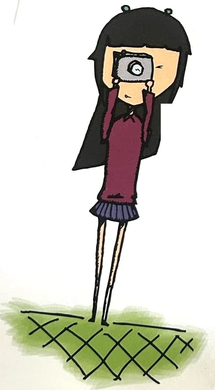 A girl holds a camera up to her face to take a picture.