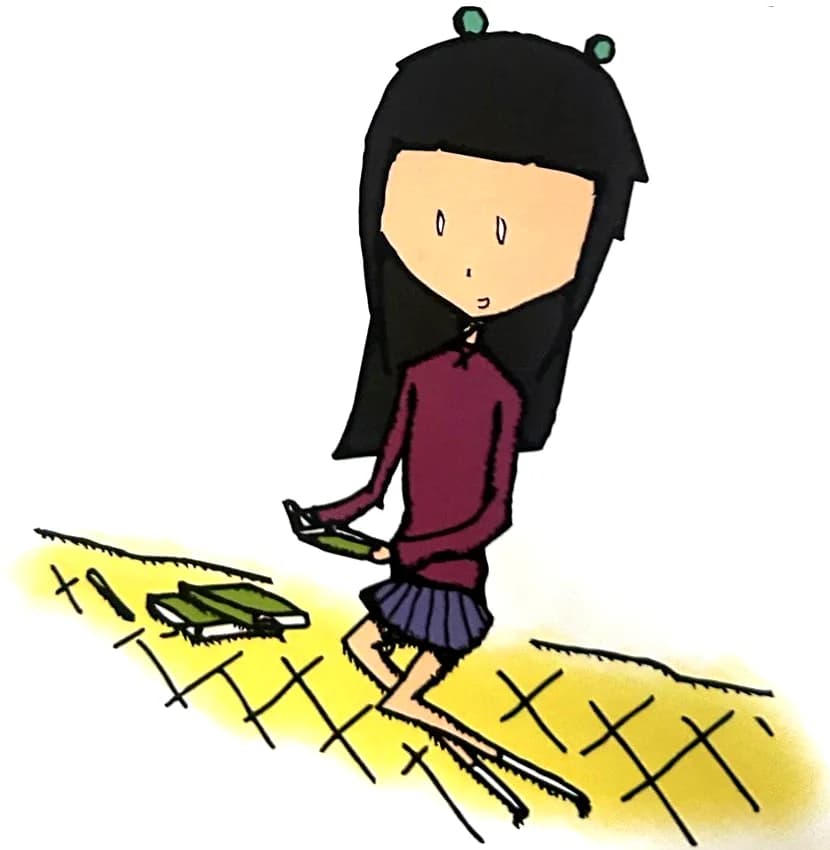 A girl sits and writes in her journal.