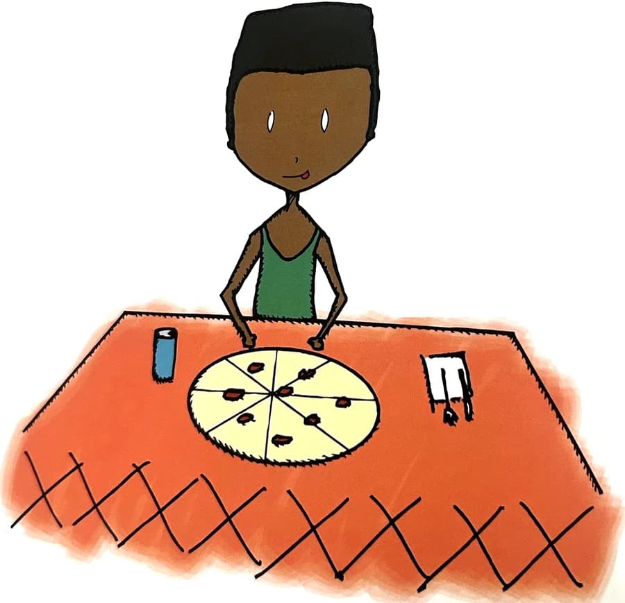 A boy licks his lips in front of a whole pizza.